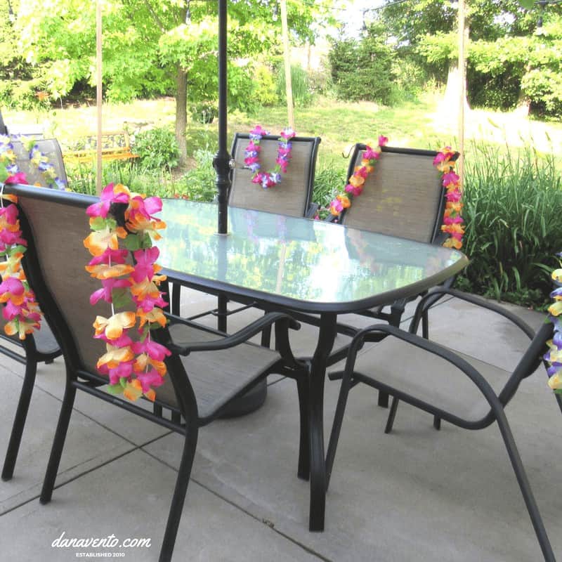 How To Throw A Pink Flamingo Themed Party with leis on the chairs