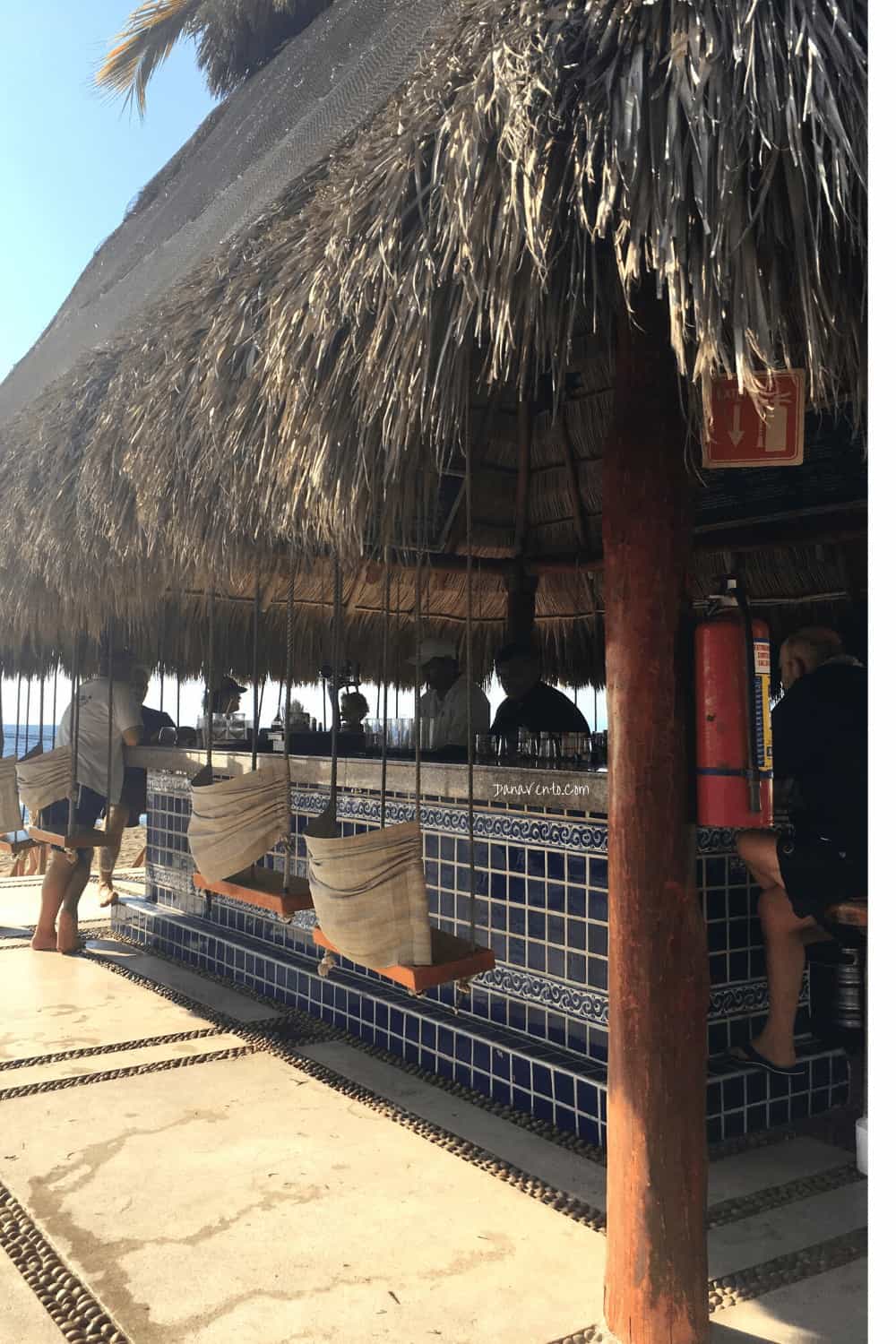 Flawlessly Indulging in the Frosty Puerto Vallarta Adult Beverages outside Tiki bar 