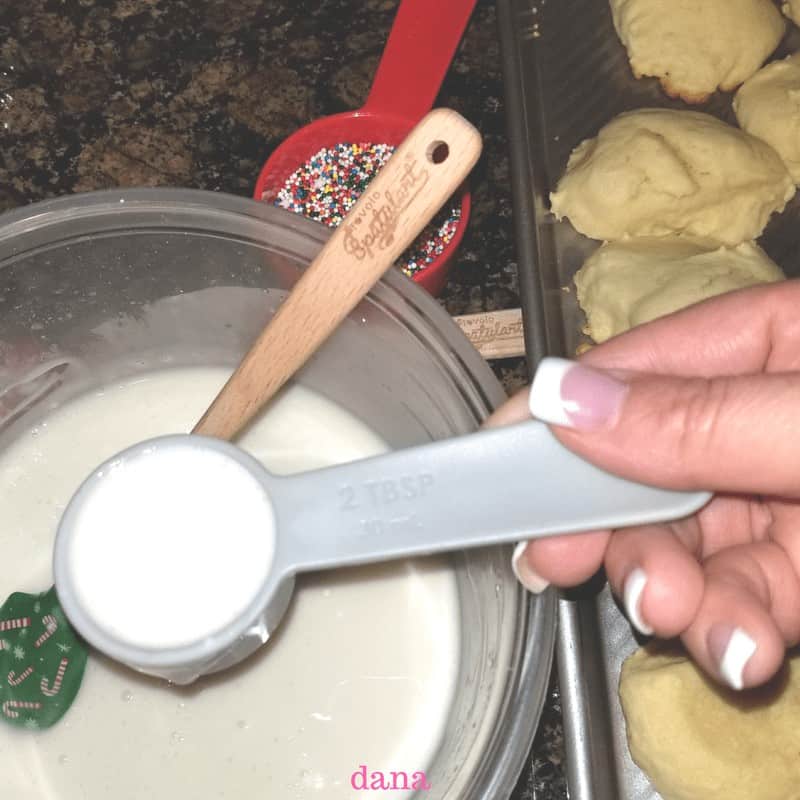 Using my simple Italian icing after baking and cooling the best Italian lemon drop cookies 