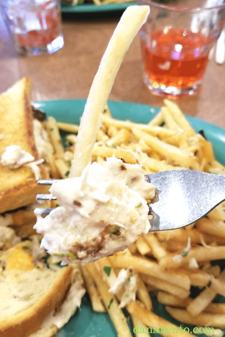 Fork with tuna melt over fries