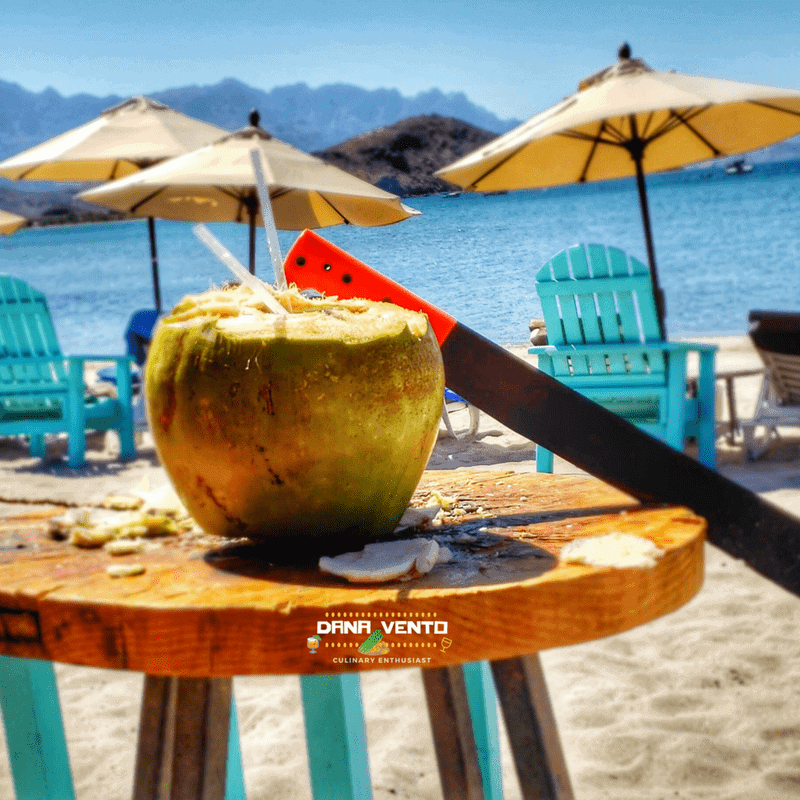 fresh chopped coconut drink on the Islands of Loreto luxury resort beach 