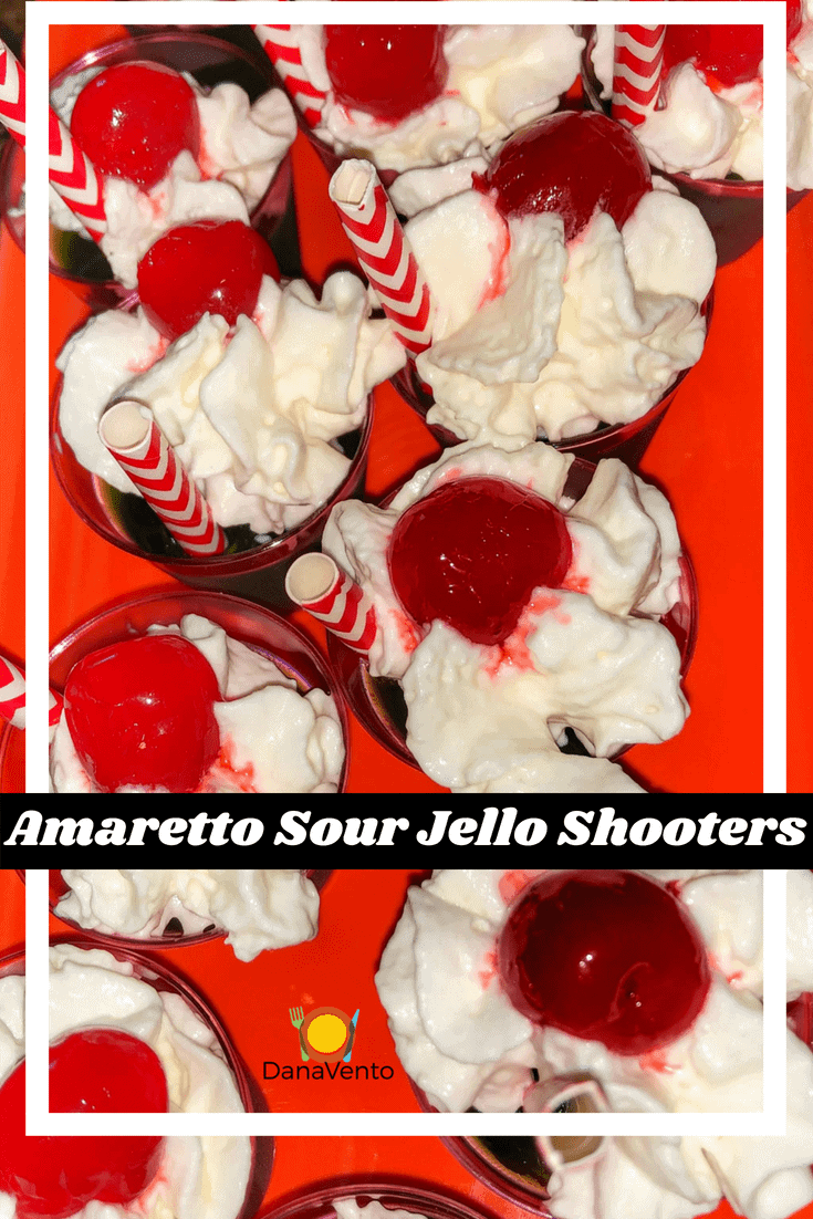 Amaretto Sour Jello Shooters with whipped cream and cherries 