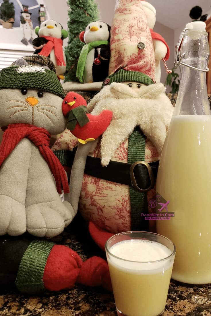easiest ever eggless eggnog in a glass with snowman behind it 