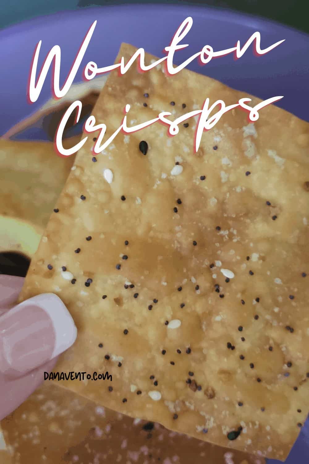 holding a wonton crisp - football snack ideas 