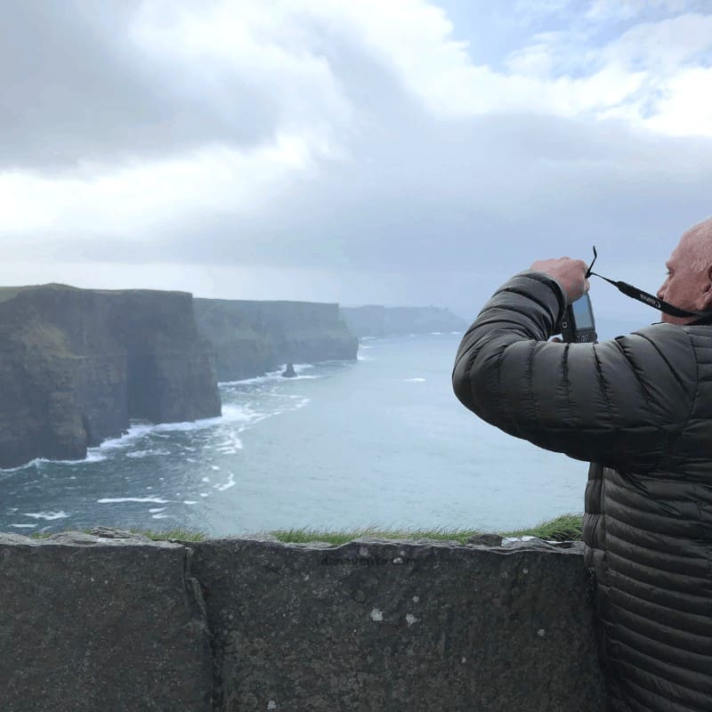 Mike snapping photos at the Cliffs of Moher