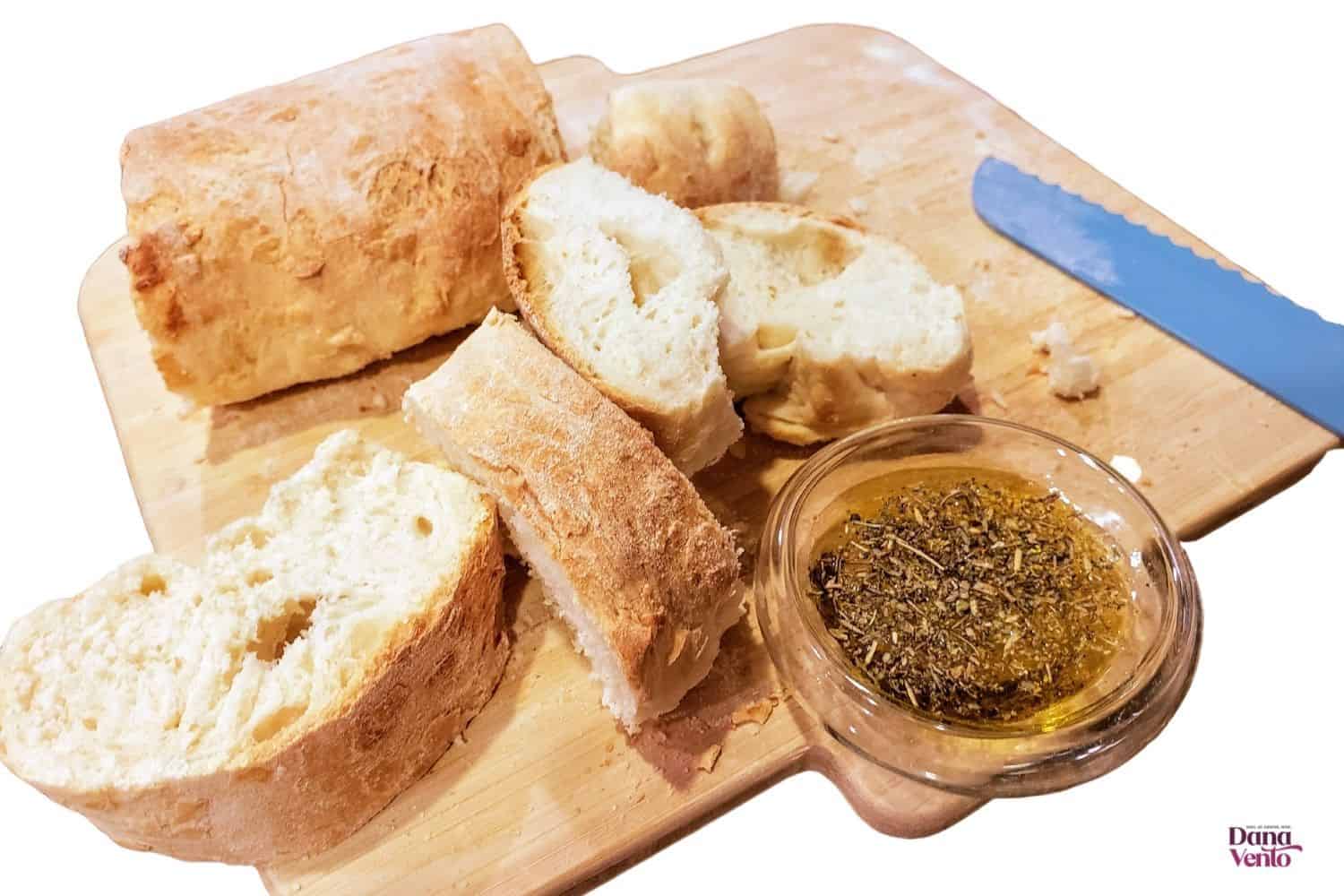 Easy beginners French Baguette Bread on board with dipping oil