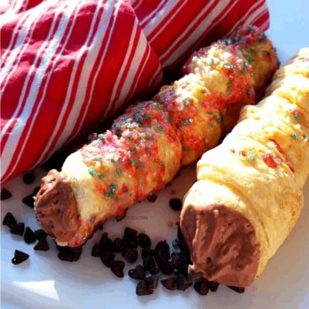 CREAM HORNS WITH CHOCOLATE FILLING, Delicious and Simple Cream Horns with Chocolate Filling, CHOCOLATE, WHIPPED, THAWED, DEFROSTED, CUT, ROLL, PINS, CANNOLI PINS, FRENCH HORNS, SWEETS, TREATS, DESSERTS, HOLIDAYS, BIRTHDAYS, PARTIES, GATHERINGS, FOOTBALL, EASY TO MAKE, DIY, FOODIE, FOODIE FABULOUS, CREAM FILLED TREATS, CHOCOLATE, SPRINKLES, JIMMIES, BAKING, HOMEMADE, NOT STORE BOUGHT, PUFF PASTRY RECIPE, HOLIDAY RECIPE, PARTY RECIPE, DANA, IN THE KITCHEN WITH DANA, FOOD TO CREATE, EASY, SIMPLE, FAST, FUN, CREAMY, PLATTERS, LARGE BATCHES, PIPING TUBE, REFRIGERATE