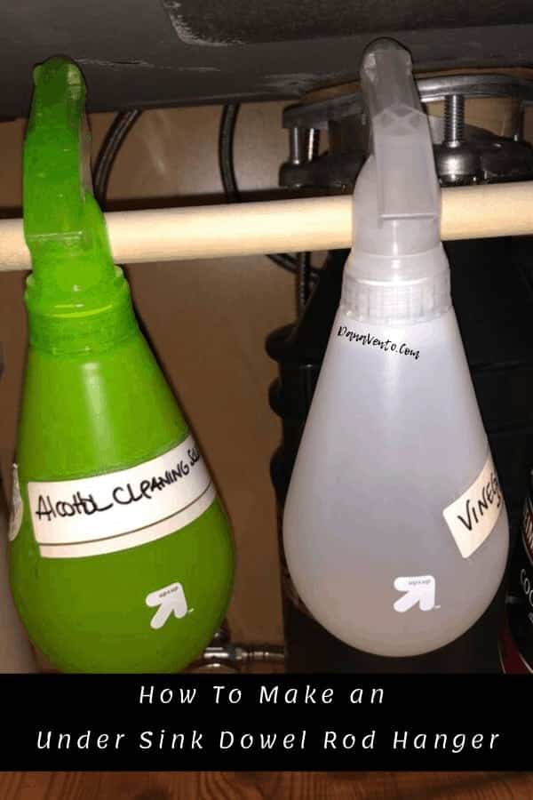 spray bottles hanging under the sink 