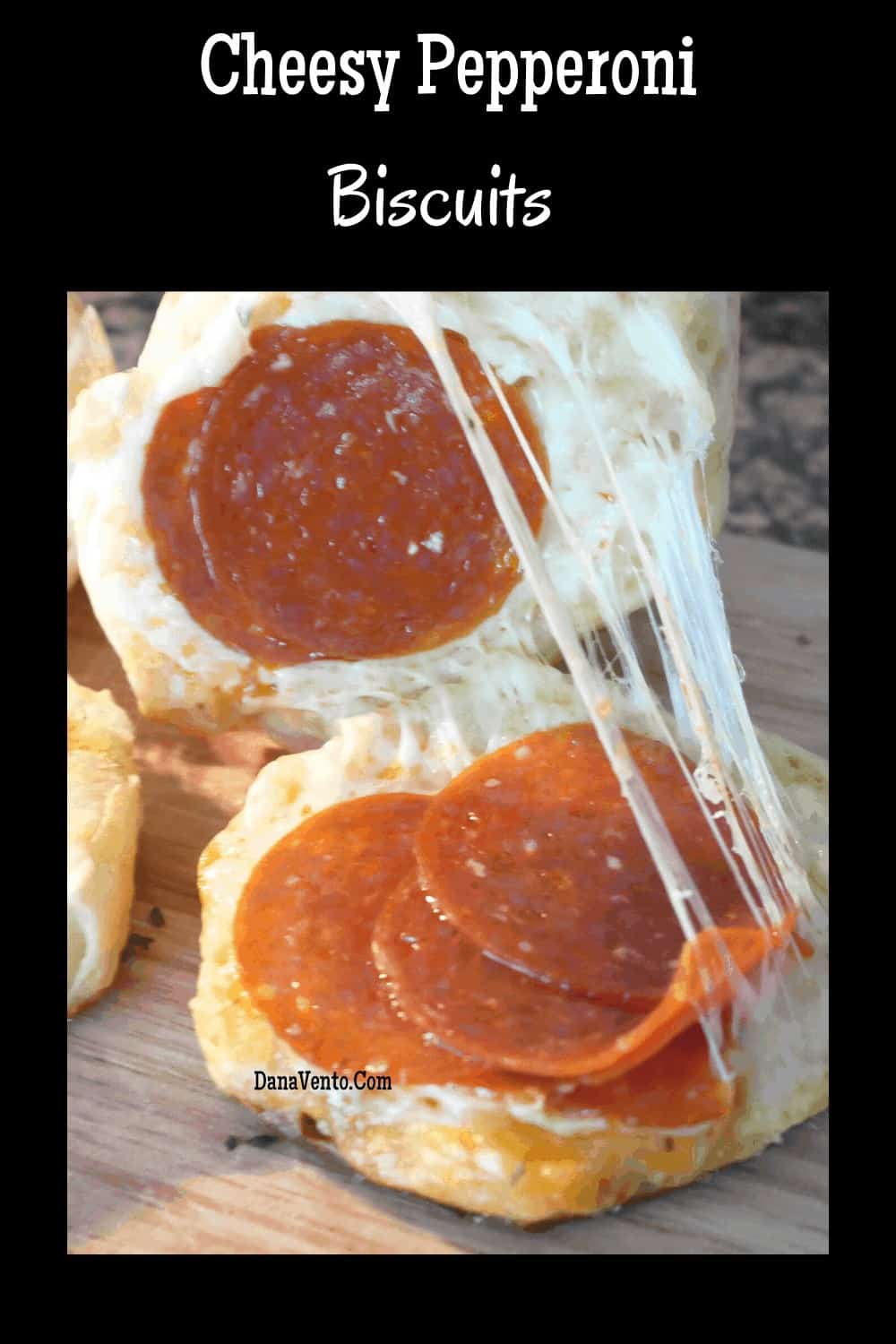 open pepperoni biscuit with cheese stretched 