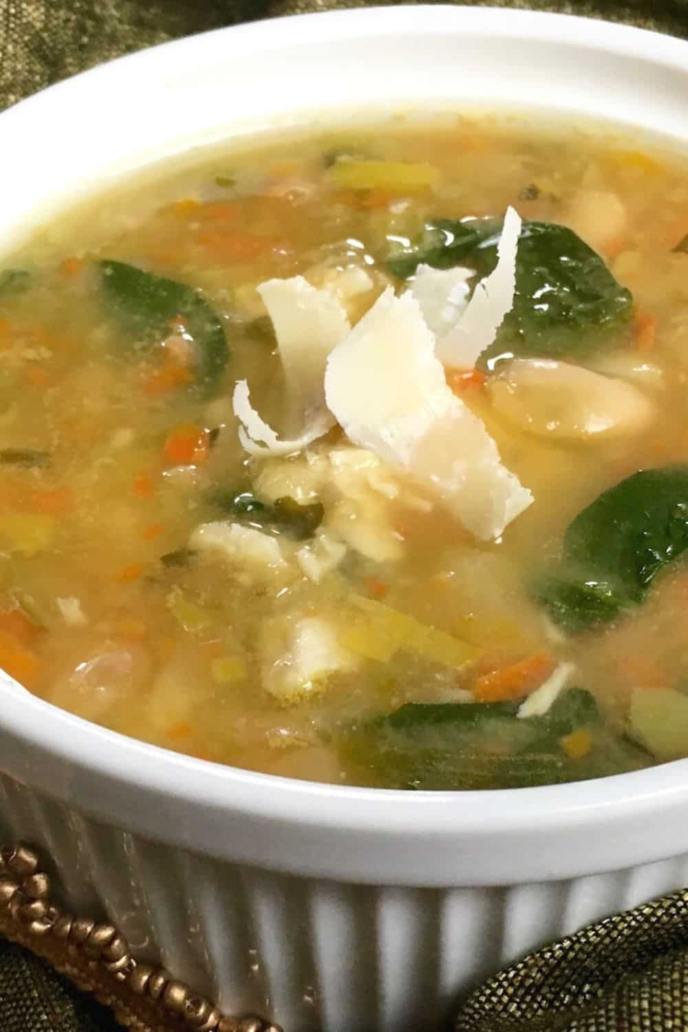 Greens and Beans Spicy Turkey Soup with shaved parmesan