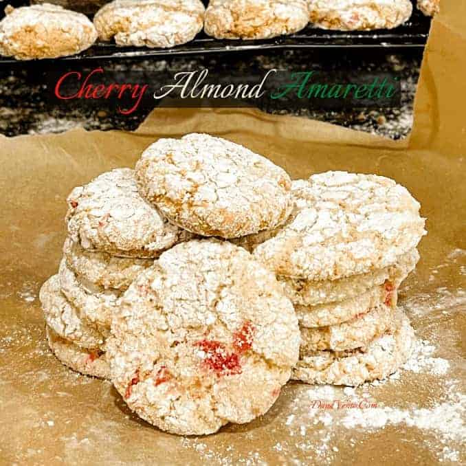 Italian Cherry Almond Cookies on pachement paper dusted with confectionary 