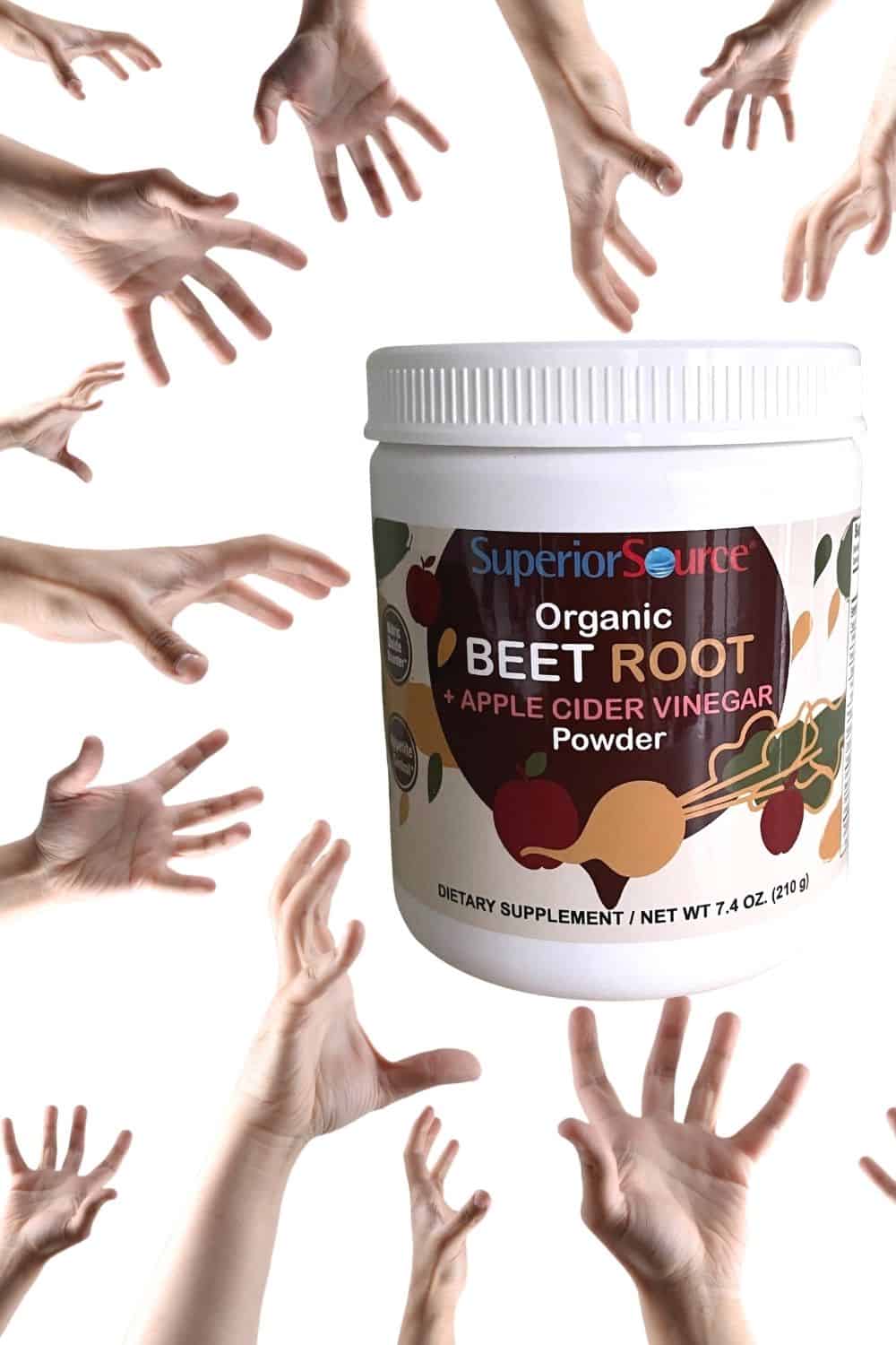 Organic Beet Root and ACV Powder hands grabbing it