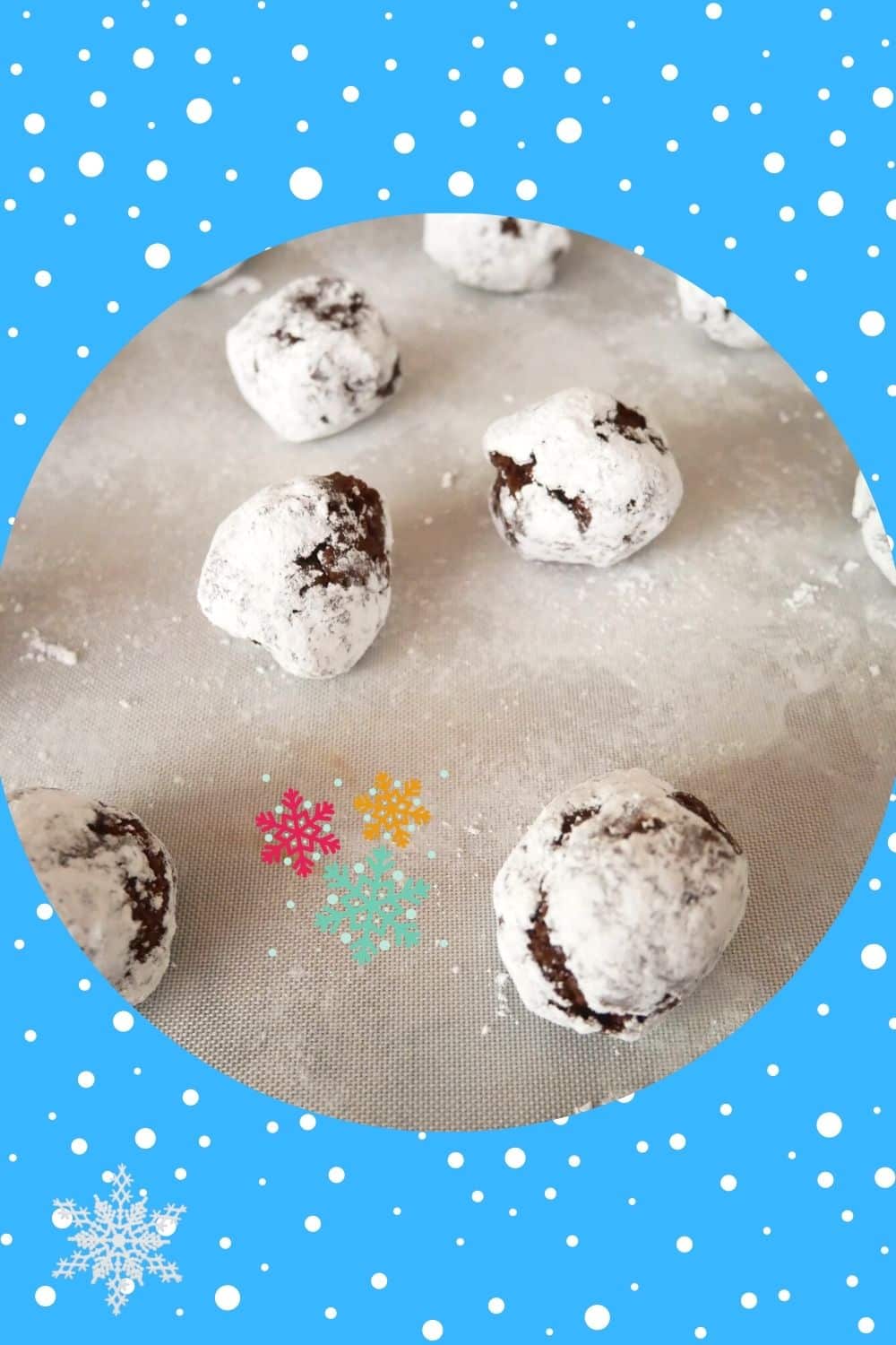 snow kissed chocolate crinkle cookies on silicone mat
