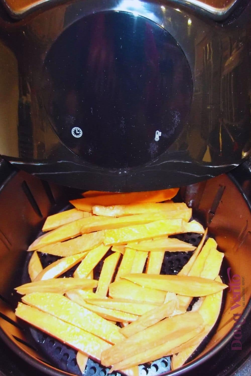 sweet potato fries in the air fryer inside the air fryer basket
