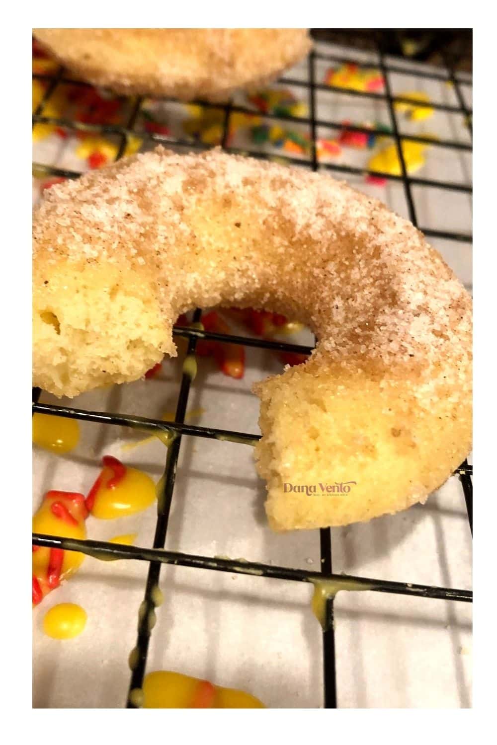 Donut on cooling rack with inside of donut as fluffy and soft
