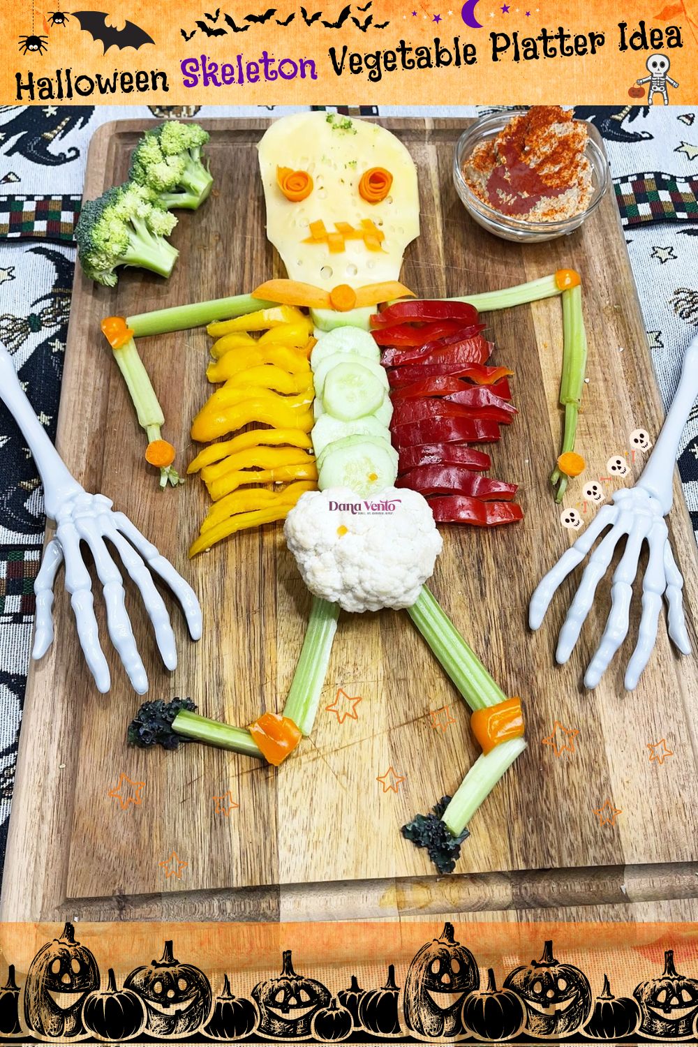 Halloween Skeleton Vegetable Platter Idea that gets placed atop a wooden cutting board