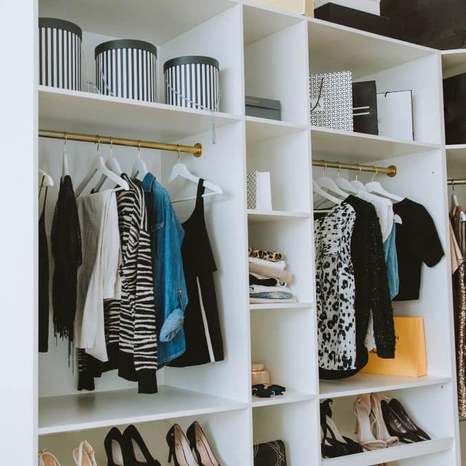 A capsule wardrobe in a closet clean and organized   