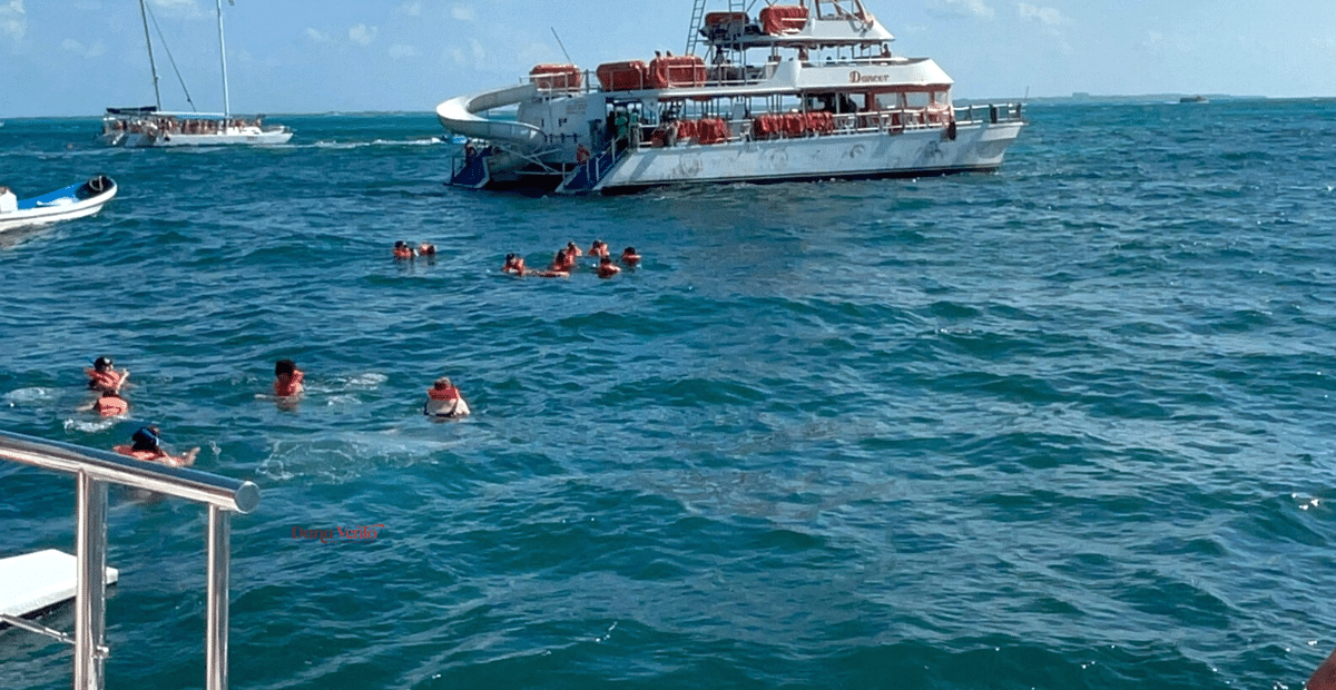 Big Reasons To AVOID Isla Mujeres Catamaran Tours and the 15 snorkelers in the water from our boat 