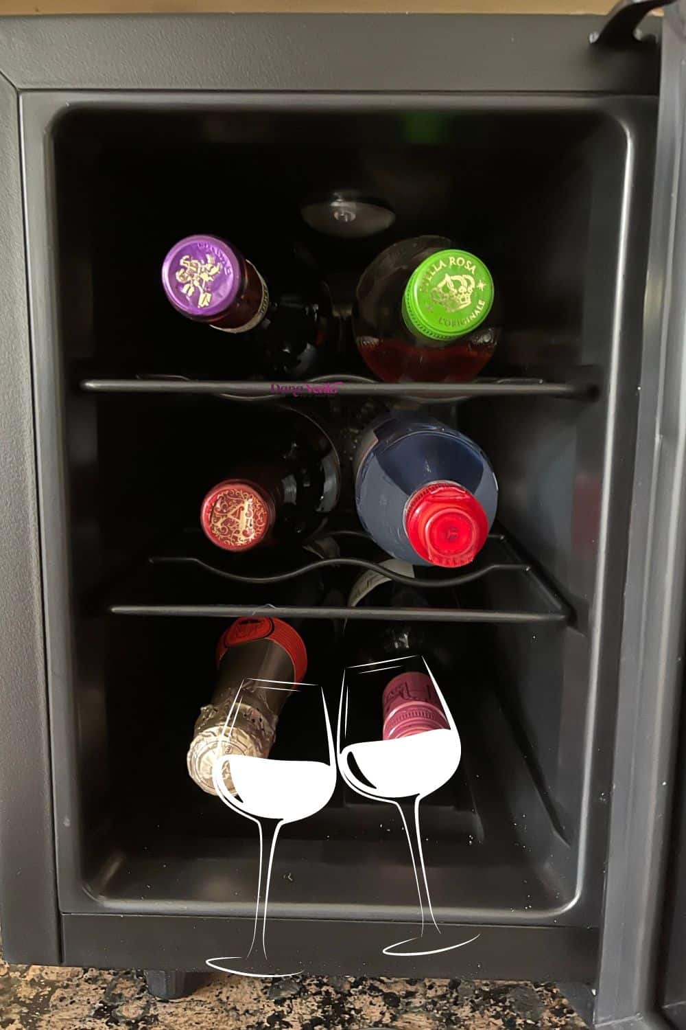 6-bottle mini wine fridge filled with water and wine and champagne