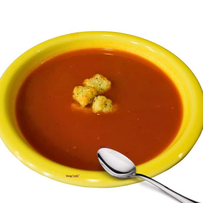 Slurp-worthy pressure cooker tomato basil soup in a bowl with a spoon