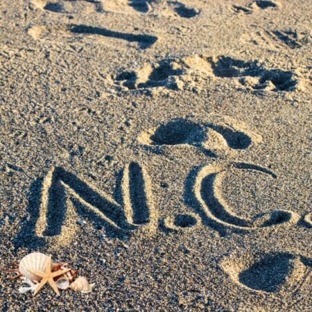 The secluded beaches in North Carolina with N C on the beach sand