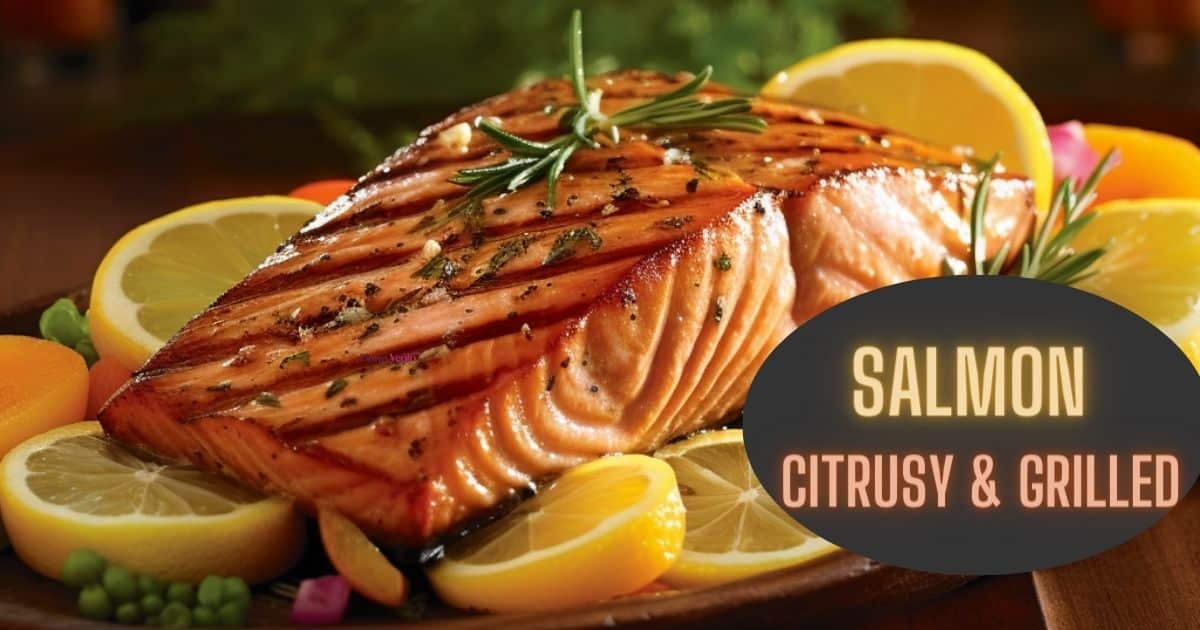 Grilled citrusy salmon atop lemons and a plate