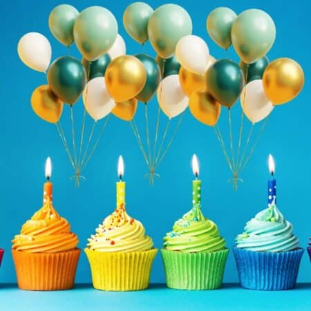 Birthday party planning cupcakes with colorful frosting, lit candles, and gold, white, and teal balloons against a bright blue background