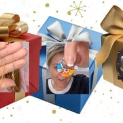 Holiday jewelry gift guide featuring gold chain necklaces, colorful evil eye pendant, and gold plated bracelet displayed inside festive gift boxes with bows.